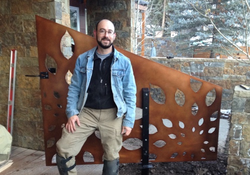 Parasoleil CEO Uriah Bueller standing in front of a finished Parasoleil panel